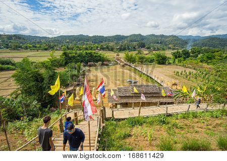 Mae Hong Son, Thailand - JAN 2, 2017: Many people walking on a bamboo bridge ( Su Tong Pe bridge) in Mae Hong Son province Thailand.