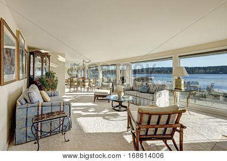 Cozy Light Filled Family Room With A Wall Of Windows