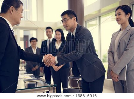 Business Partners Introductionary Handshake Bow