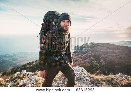 Bearded Man backpacker hiking in mountains Travel Lifestyle concept adventure active vacations outdoor mountaineering sport