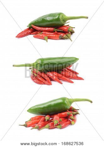 Pile of red italian peppers with a green jalapeno over it, composition isolated over the white background, set of three different foreshortenings
