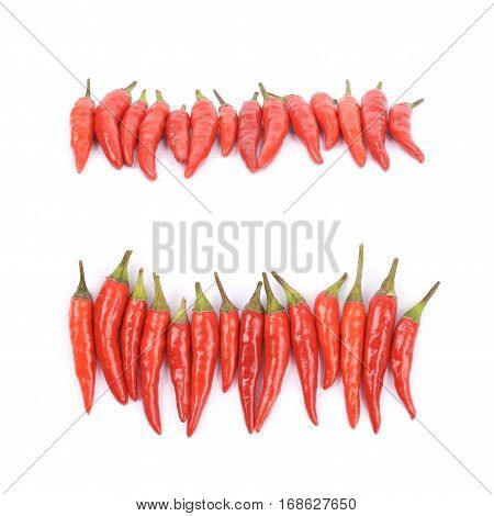 Lined up pile of red italian peppers isolated over the white background, set of two different foreshortenings