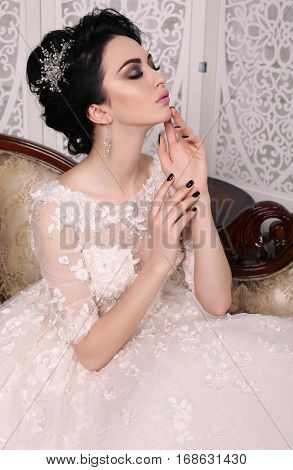 Gorgeous Bride With Dark Hair In Luxuious Wedding Dress