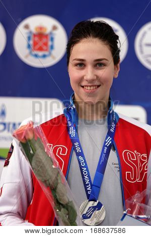 ST. PETERSBURG, RUSSIA - DECEMBER 17, 2016: Silver medalist in women 200 m breaststroke swimming Sofia Andreeva in medal ceremony of X Vladimir Salnikov Cup. Athletes from 6 countries participated