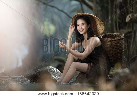 Asian sexy woman bathing in cascade Thailand