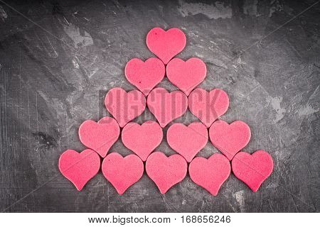 red and pink hearts on grey background
