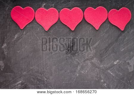 red and pink hearts on grey background