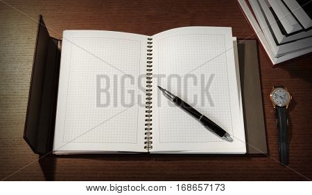 Top view office desk mockup with notepad, pen, books and watch