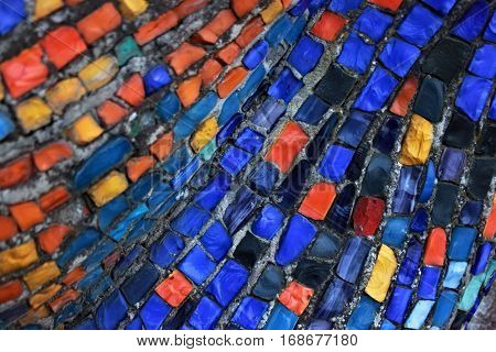 Colorful pattern of geometric mosaic old wall from smalt.