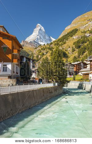 ZERMATT, SWITZERLAND - September 02: Hotel Perren with views of the Matterhorn in central Zermatt and river Matter Vispa, Switzerland on September 02, 2016