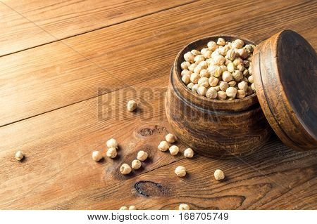 Portion of Chick Peas in wooden bowl.