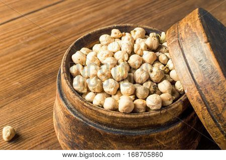 Portion of Chick Peas in wooden bowl.