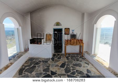 Georgioupolis Island Crete Greece - June 26 2016: Interior of small Saint Nicholas Church that is located in the sea on the stones and rocks.