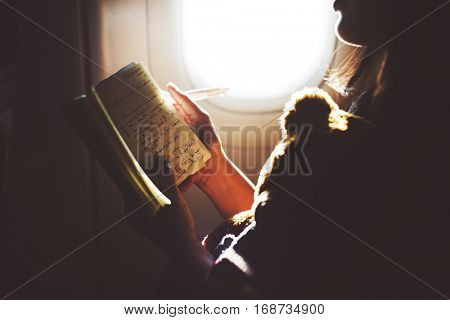 Woman Reading Book Plane Flying Concept