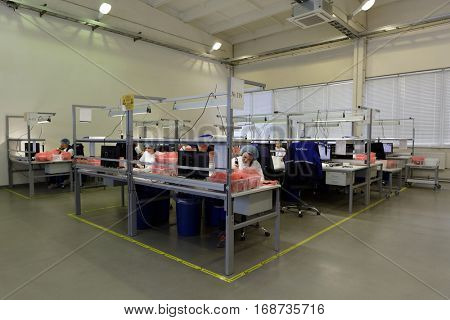 ST. PETERSBURG, RUSSIA - NOVEMBER 2, 2016: People at work on the production site of StarLine company. It is one of the leading company on the automotive security market of Russia