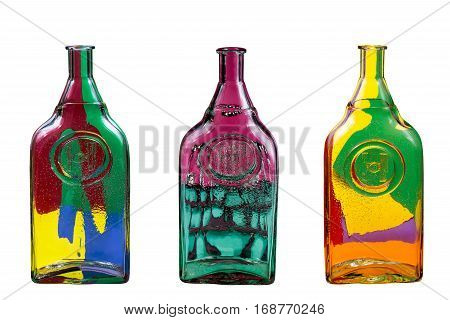 Three glass bottles with an abstract pattern on a white background