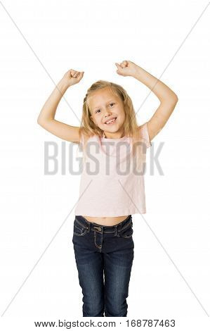 young beautiful and happy female child gesturing excited and smiling cheerful rising arms isolated on white background in school girl success and self confidence