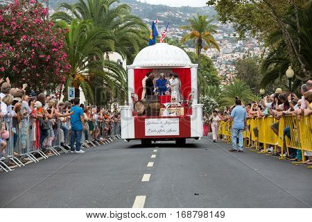 FUNCHAL MADEIRA PORTUGAL - SEPTEMBER 4 2016: Men in historical fashion dress raise toasts durnig historical and ethnographic parade of Madeira Wine Festival in Funchal. Madeira Portugal