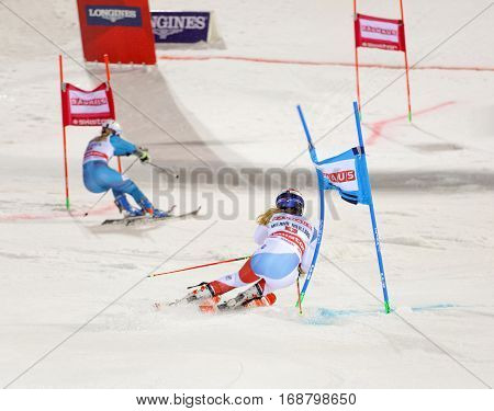 STOCKHOLM SWEDEN - JAN 31 2017: Side view of Melanie Meillard (SUI) and Nina Loeseth in the downhill skiing in the parallel slalom alpine event Audi FIS Ski World Cup. January 31 2017 Stockholm Sweden