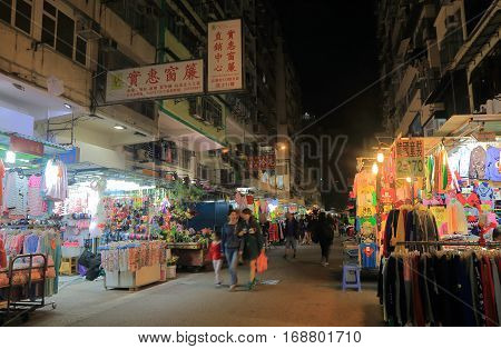 HONG KONG - NOVEMBER 9, 2016: Unidentified people visit Tung Choi Street night market. Tung Choi Street night market is one of the most well- known street markets in Hong Kong.