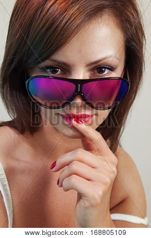 portrait of lovely woman in bright sunglasses over white 