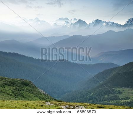 Hills during sunrise in mountain valley. Beautisul natural landscape