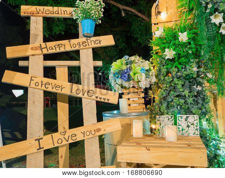 weddinglovehappy on wood and green leaf background