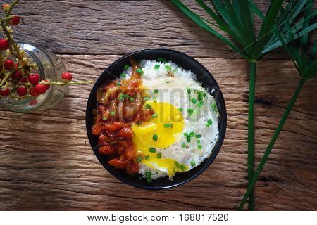 Rice With Fried Egg And Tomato Sauce On Table Vintage Wooden Surface Top View
