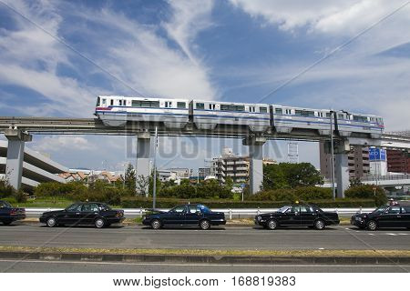 Osaka, Japan - Aug 10, 2015: Osaka Monorail And Taxi Near The Osaka International Airport