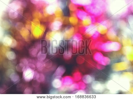 abstract festive christmas multicolored background from bright defocused tinsel with bokeh