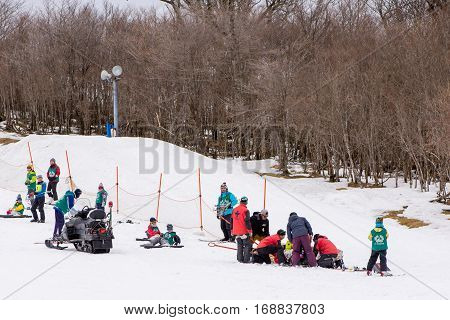February 4 2017. Paramedics prepare a patient injured during a snowboarding accident for treatment at a hospital. Gokase highland ski Miyazaki Japan.