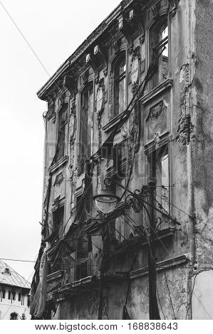 Facade of the destroyed building with classical moldings.