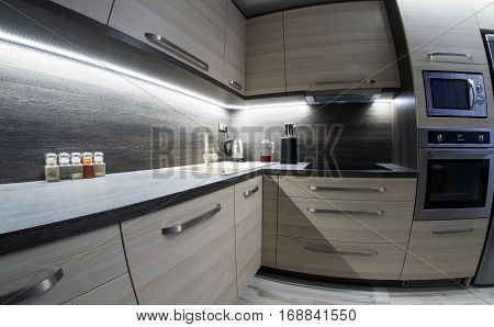 Led backlight in small kitchen with modern furniture