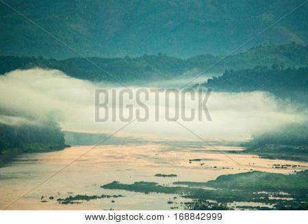 Viewer morning mist on the river Mekong two of Thailand - Laos.