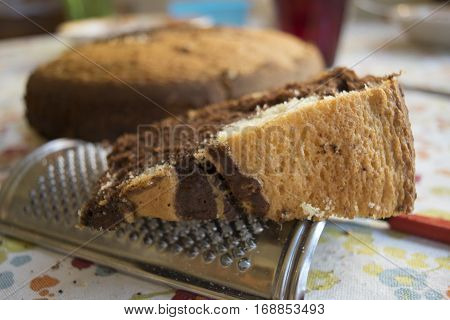 slice of homemade chocolate and vanilla sponge cake