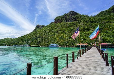 Bohey Dulang,Semporna,Sabah-Sept 10,2016:Jetty at Bohey Dulang,Semporna,Sabah with background of beautiful island of Bohey Dulang on 10th Sept 2016.Bohey Dulang Island is one of the most popular and attraction islands in Tun Sakaran Marine Park.