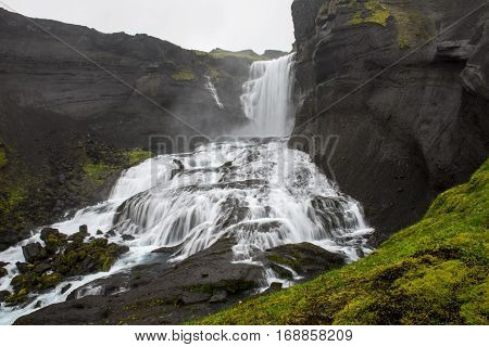 Two-tiered waterfall Ofaerufoss in the Eldgja canyon in the central Iceland
