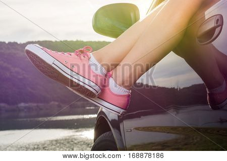Legs Out Of The Car Window By The Lake