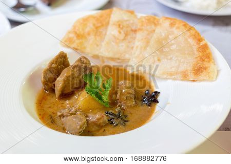 Lamb massaman curry on a white dish
