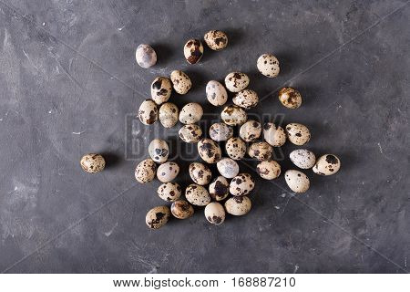 Quail eggs on a gray background. Eggs. Easter photo concept. Copyspace