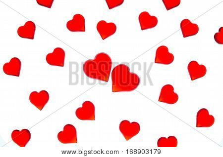 Bright red hearts on a striped background with two red hearts. In order to use Valentine's Day, weddings, International Women's Day