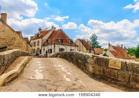 Bridge Pinard in picturesque medieval town of Semur en Auxois Burgundy France. The traslation of the words on the plate is 'Bridge Pinard' 'Commune of Semur en Auxois'