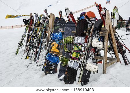 HINTERTUX, AUSTRIA - MARCH 29, 2015: Skier and snowboards standing on a wooden frame close to the Grillhofalm at Horberg mountain in Tyrol Austria