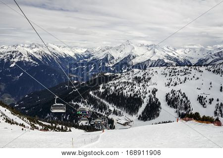 HINTERTUX, AUSTRIA - MARCH 29, 2015: Ski lift and a steep black piste at Horberg mountain in Tyrol Austria