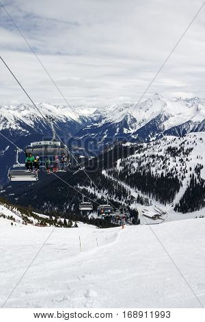 HINTERTUX, AUSTRIA - MARCH 29, 2015: Ski lift and a steep black piste at Horberg mountain in Tyrol Austria