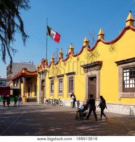 MEXICO CITY,MEXICO - DECEMBER 24,2016 : People next to the colonial Town Hall Palace at Coyoacan in Mexico City