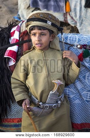 Muscat Oman February 4th 2017: young omani boy in traditional clothing
