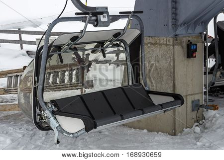 The ski lift Sun Jet at the Horberg mountain in Tyrol Austria with people in the queue for a lift to the mountaintop