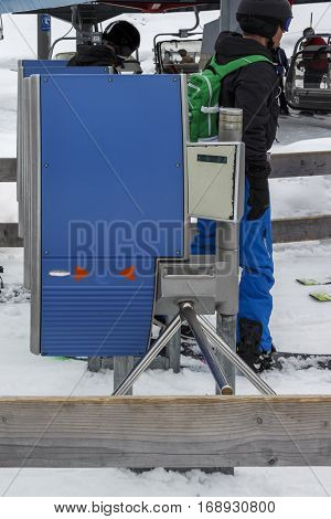 The ski lift Sun Jet at the Horberg mountain in Tyrol Austria with people in the queue for a lift to the mountaintop