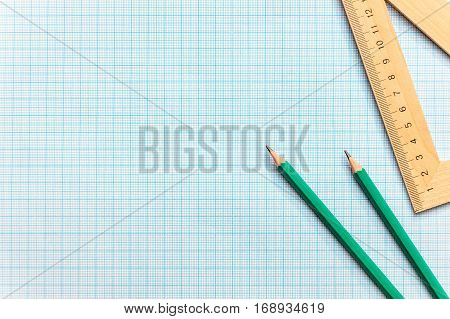 Pencils with ruller on the graph paper.